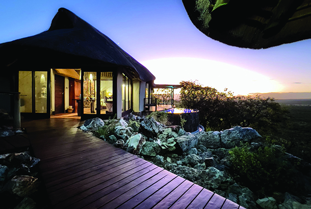 Night view of outdoor walkway leading to private suite